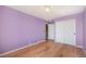 Bedroom featuring hardwood floors, a closet, and door that leads to a stairway at 6833 E 115Th Ave, Thornton, CO 80233