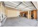 Spacious two-car garage providing ample storage and parking space, with door to the house at 6833 E 115Th Ave, Thornton, CO 80233
