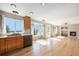 Bright and airy kitchen featuring hardwood floors, stainless appliances, and ample natural light at 6833 E 115Th Ave, Thornton, CO 80233