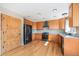 Modern kitchen featuring stainless steel appliances, ample cabinetry, and hardwood floors at 6833 E 115Th Ave, Thornton, CO 80233