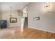 Bright living room with hardwood floors, staircase, and large windows at 6833 E 115Th Ave, Thornton, CO 80233