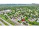 Aerial view of a suburban home nestled among green trees, offering a sense of community and location at 10925 W Montana Pl, Lakewood, CO 80232