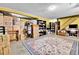 Basement area featuring ample storage with boxes, neutral walls, shelving, a desk, and a patterned area rug at 10925 W Montana Pl, Lakewood, CO 80232