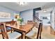 Light filled dining room with a view into the kitchen and staircase at 10925 W Montana Pl, Lakewood, CO 80232