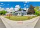 Corner lot home with mature trees and a well manicured lawn at 10925 W Montana Pl, Lakewood, CO 80232