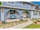 Inviting front porch with cozy seating and decorative landscaping at 10925 W Montana Pl, Lakewood, CO 80232