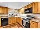 Well-appointed kitchen with stainless steel appliances and ample counter space at 10925 W Montana Pl, Lakewood, CO 80232