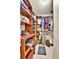Walk-in closet boasting custom built-in shelving and ample storage space for clothes and accessories at 10925 W Montana Pl, Lakewood, CO 80232