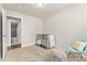 Cozy bedroom featuring a comfortable carpet, neutral paint, and natural lighting at 2965 Ivy St, Denver, CO 80207