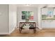 Cozy dining area boasts a window view and flows into the adjacent kitchen space at 2965 Ivy St, Denver, CO 80207