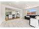 Bright living room showcasing an open floorplan and connecting to the kitchen at 2965 Ivy St, Denver, CO 80207