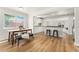 Bright open floorplan features seamlessly connected kitchen and dining areas at 2965 Ivy St, Denver, CO 80207
