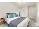 Relaxing main bedroom with a comfortable bed and neutral color scheme with an ensuite bathroom at 2965 Ivy St, Denver, CO 80207