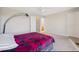 Cozy bedroom with neutral walls and a glimpse of an adjoining bathroom at 11293 Latigo Ln, Parker, CO 80138