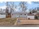 Spacious backyard featuring a storage shed and partial gravel cover for gardening at 2248 Lima St, Aurora, CO 80010