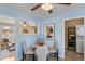 Cozy dining area with stylish seating, modern art, and convenient access to living room and laundry at 2248 Lima St, Aurora, CO 80010