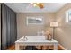 Cozy home office space with hardwood floors and plenty of natural light at 2248 Lima St, Aurora, CO 80010