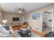 Spacious living room offering hardwood floors, neutral color palette, and seamless kitchen access at 2248 Lima St, Aurora, CO 80010