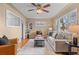 Bright living room featuring a comfortable sofa, stylish decor, and ample natural light at 2248 Lima St, Aurora, CO 80010