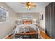 Comfortable main bedroom with a plush bed, decorative pillows, and warm lighting at 2248 Lima St, Aurora, CO 80010