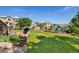 Spacious backyard features lush lawn, playset, landscaping, and patio perfect for outdoor enjoyment at 9745 Hummingbird Pl, Littleton, CO 80125