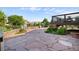 Large backyard with a stone patio and landscaping at 9745 Hummingbird Pl, Littleton, CO 80125