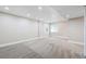 Spacious basement with new carpet, recessed lighting, and freshly painted walls at 9745 Hummingbird Pl, Littleton, CO 80125