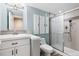Updated bathroom featuring modern fixtures, shower, and storage at 9745 Hummingbird Pl, Littleton, CO 80125