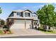 Charming two-story home with a three car garage and craftsman details at 9745 Hummingbird Pl, Littleton, CO 80125