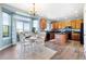 Bright kitchen with wood cabinets, black appliances, granite counters, and a breakfast nook with a view at 9745 Hummingbird Pl, Littleton, CO 80125