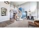 Open concept living space with wood floors, high ceilings, and neutral carpet at 9745 Hummingbird Pl, Littleton, CO 80125