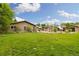 Expansive backyard features lush green lawn and professionally landscaped areas perfect for outdoor enjoyment at 10380 W Warren Ave, Lakewood, CO 80227
