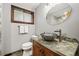 Charming bathroom featuring a unique pebble countertop and decorative glass vessel sink at 10380 W Warren Ave, Lakewood, CO 80227