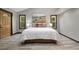 Comfortable bedroom with hardwood floors, modern lighting, and neutral decor creating a serene atmosphere at 10380 W Warren Ave, Lakewood, CO 80227