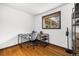 Bright home office features hardwood floors, ample natural light, and a minimalist aesthetic at 10380 W Warren Ave, Lakewood, CO 80227