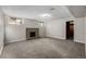 View of finished basement with neutral walls and new carpet at 620 Newport St, Denver, CO 80220