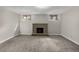 Finished basement with new carpet, neutral walls, and fireplace at 620 Newport St, Denver, CO 80220