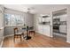 Bright dining area features hardwood floors and connects seamlessly to the modern kitchen at 620 Newport St, Denver, CO 80220