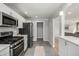 Bright kitchen showcasing stainless steel appliances and an open layout at 620 Newport St, Denver, CO 80220