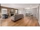 Spacious living room with natural light, hardwood floors, fireplace, and a cozy seating area at 620 Newport St, Denver, CO 80220