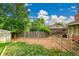 A beautiful backyard featuring mature trees and playground area at 1030 Kohl St, Broomfield, CO 80020