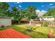 Beautiful backyard featuring a small shed, grass and an outdoor dining set at 1030 Kohl St, Broomfield, CO 80020