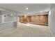 Finished basement boasting a brick fireplace and neutral carpeting at 1030 Kohl St, Broomfield, CO 80020