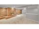 Finished basement showcasing a cozy fireplace and large carpeted area at 1030 Kohl St, Broomfield, CO 80020