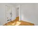 Bedroom featuring decorative closet doors and wood flooring at 1030 Kohl St, Broomfield, CO 80020