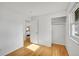 Bright bedroom with hardwood floors and an ensuite doorway at 1030 Kohl St, Broomfield, CO 80020