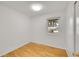 Small bedroom offers hardwood floors and a bright window at 1030 Kohl St, Broomfield, CO 80020