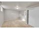 Bedroom featuring neutral carpeting, a closet, and ample natural light at 1030 Kohl St, Broomfield, CO 80020