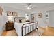 Cozy bedroom featuring a metal frame bed, ceiling fan, and natural light at 1030 Kohl St, Broomfield, CO 80020