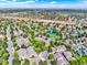 Areal view of a residential area with community amenities like tennis courts and green spaces nestled among well-maintained homes at 3426 W 98Th W Dr # A, Westminster, CO 80031